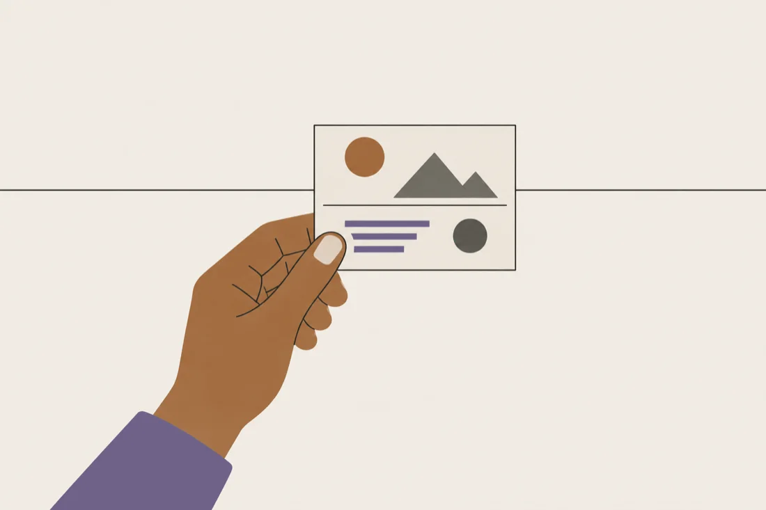An illustration of a hand holding one small printed card carrying a horizontal line and a few simple shapes.